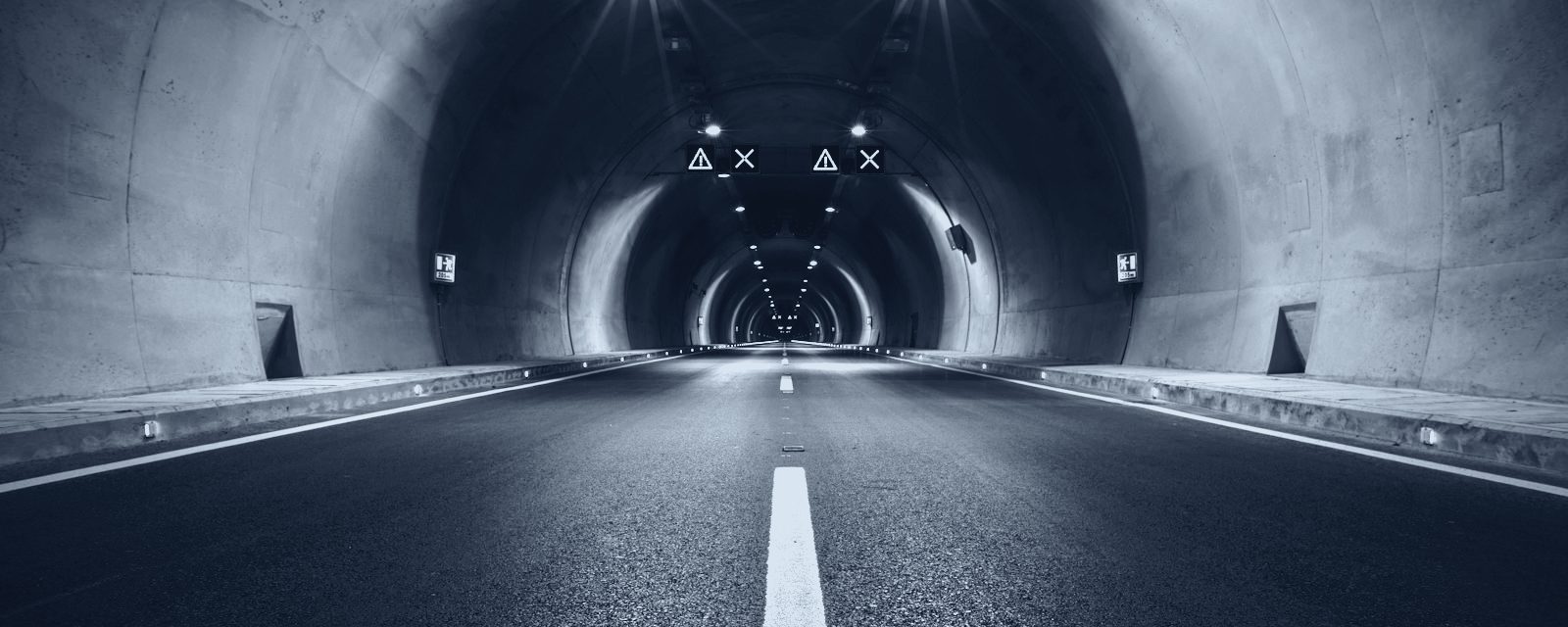 Empty road tunnel in slate duotone — atmospheric imagery